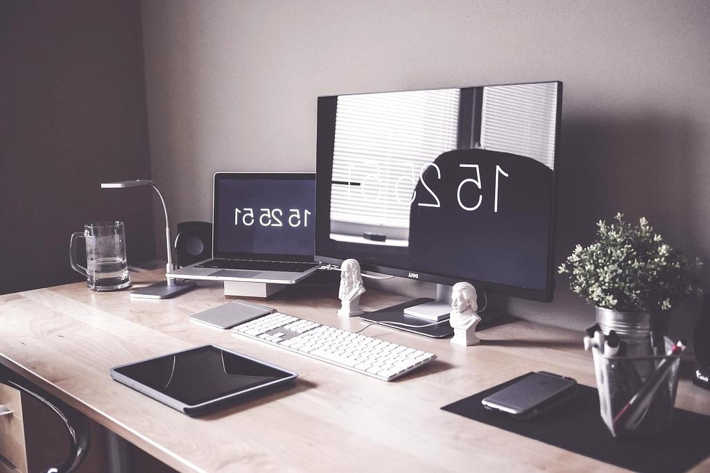 Person working productively at a modern desk setup